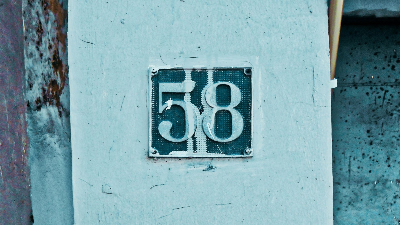 a number sign on the side of a building