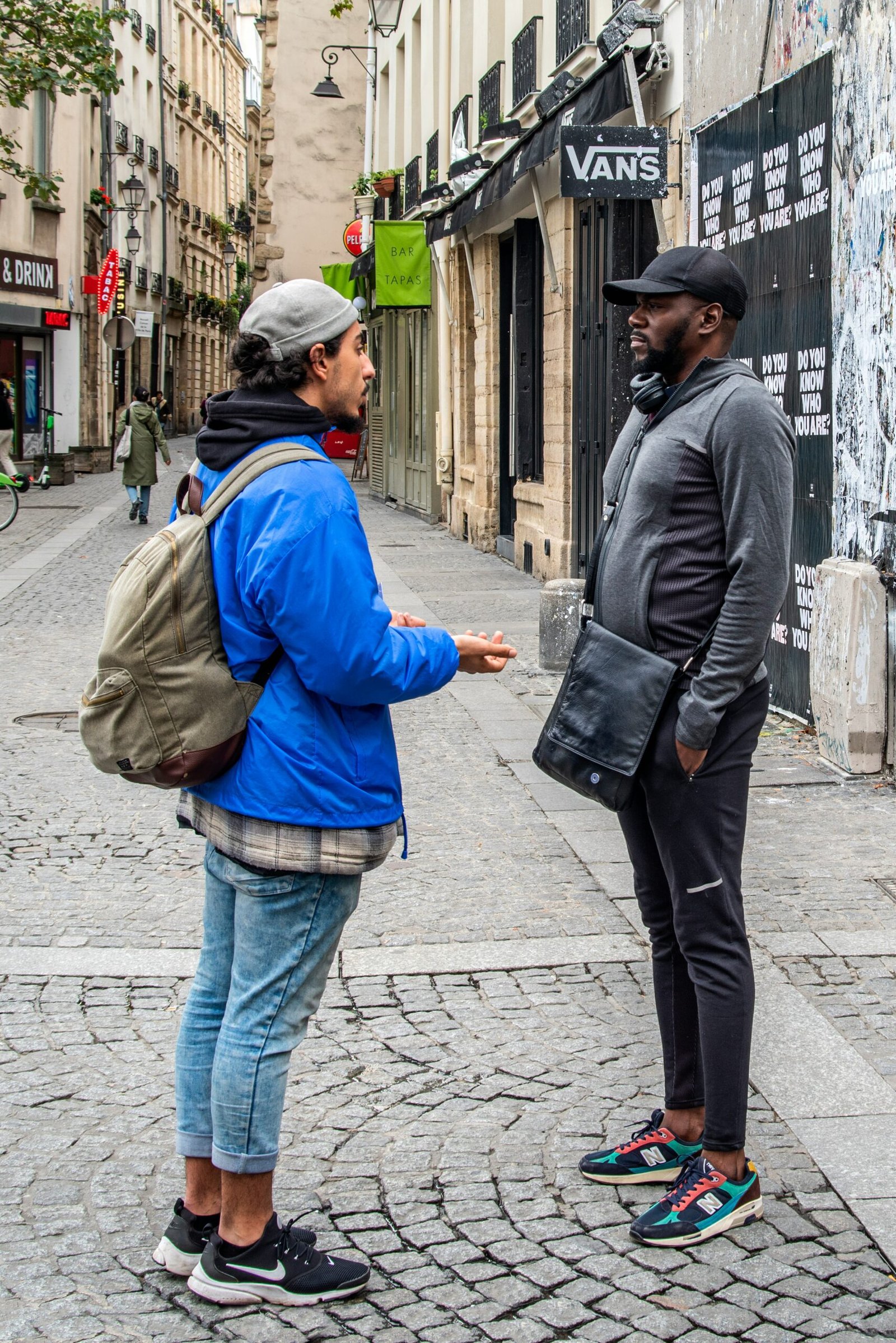 two person standing near building